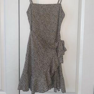 Green dress with white leaf detail. Spaghetti straps.